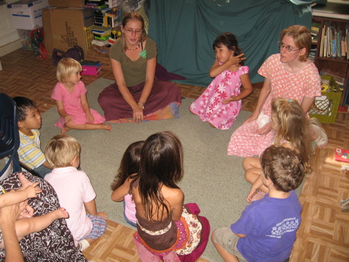 Children and their teachers enjoying play songs during Sunday School