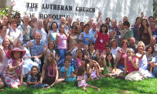 Our members wave a welcome in front of the church