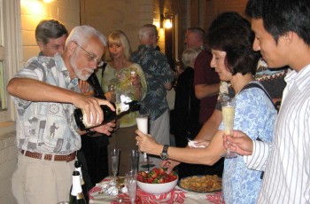 Steve Miller pours champagne for Jeannie Castello
