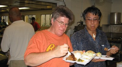 Cooks April Smith and Jimmy Castro enjoy their own plates after the guests had been served.