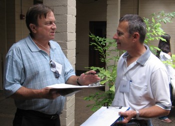 Project Coordinator Jim Sullivan signs Fred Benco up to help with the demolition