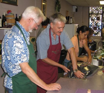 Jim Cartwright and Michael Burnett mixing wine