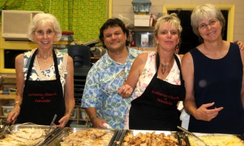 Members of the Hörmann family working hard in the kitchen