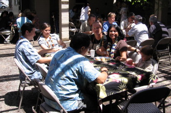 The Schmidt family in conversation during potluck.