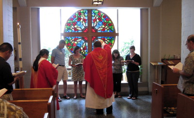 Pastor Jeff blesses the new members following their profession of faith.