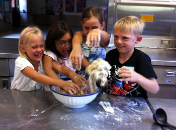 All young class members get into the act as they see where communion on comes from