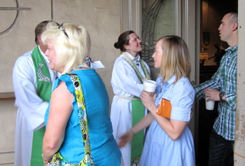 Pastor Jeff and Pastor Angela greet members of the congregation following worship