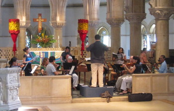Miguel Felipe leads a rehearsal for the soprano duet.
