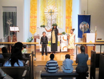 A family offers  skit about Adam and Eve in the Garden as part of eARTh Sunday