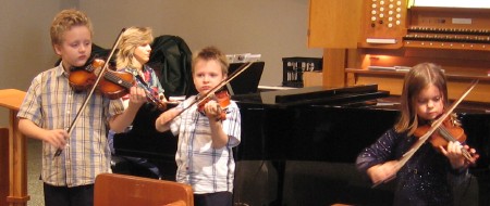 Three of the children performed Shinichi Suzuki’s “Perpetual Motion.”